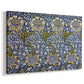 Canvas art print featuring a textile design featuring animals among foliage in repeating arrangement, displayed at an angle
