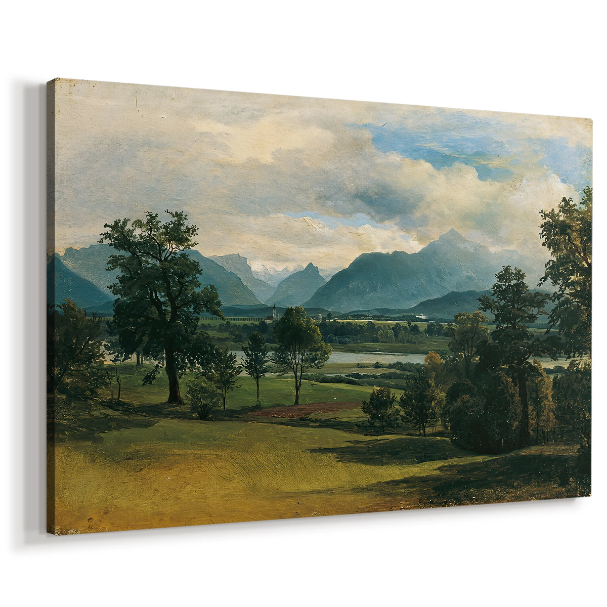 Canvas art print featuring a pastoral scene with distant buildings and natural terrain, displayed at an angle