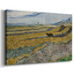 Canvas art print featuring a rural landscape with ploughman crossing yellow and blue field bands, displayed at an angle