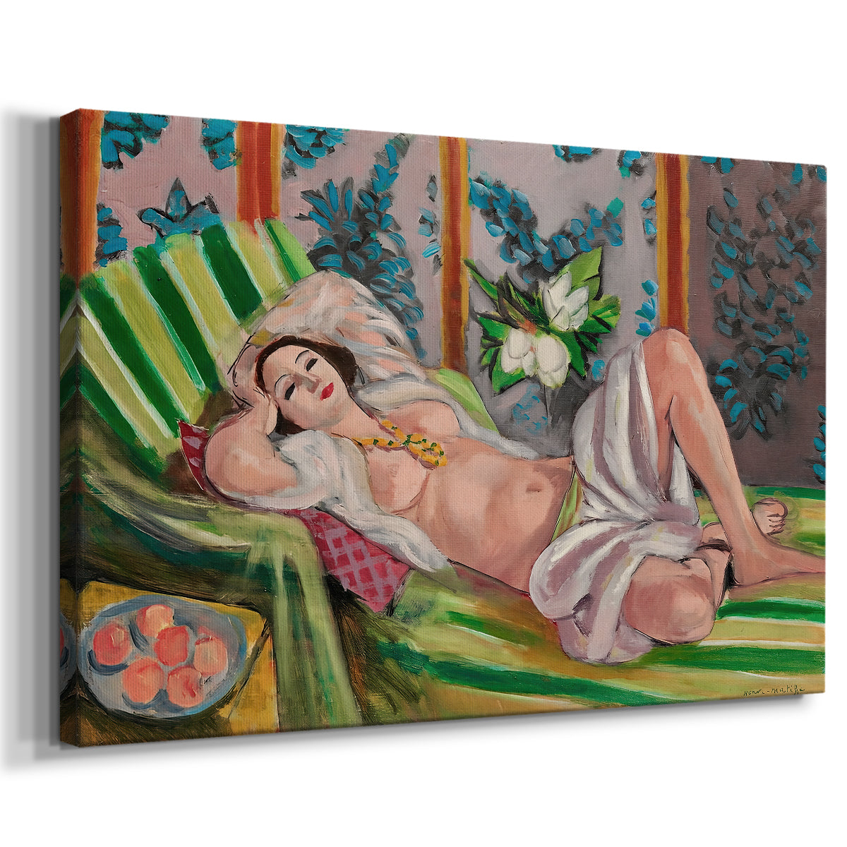 Canvas art print featuring a woman lying on patterned textiles in a vivid decorative setting, displayed at an angle