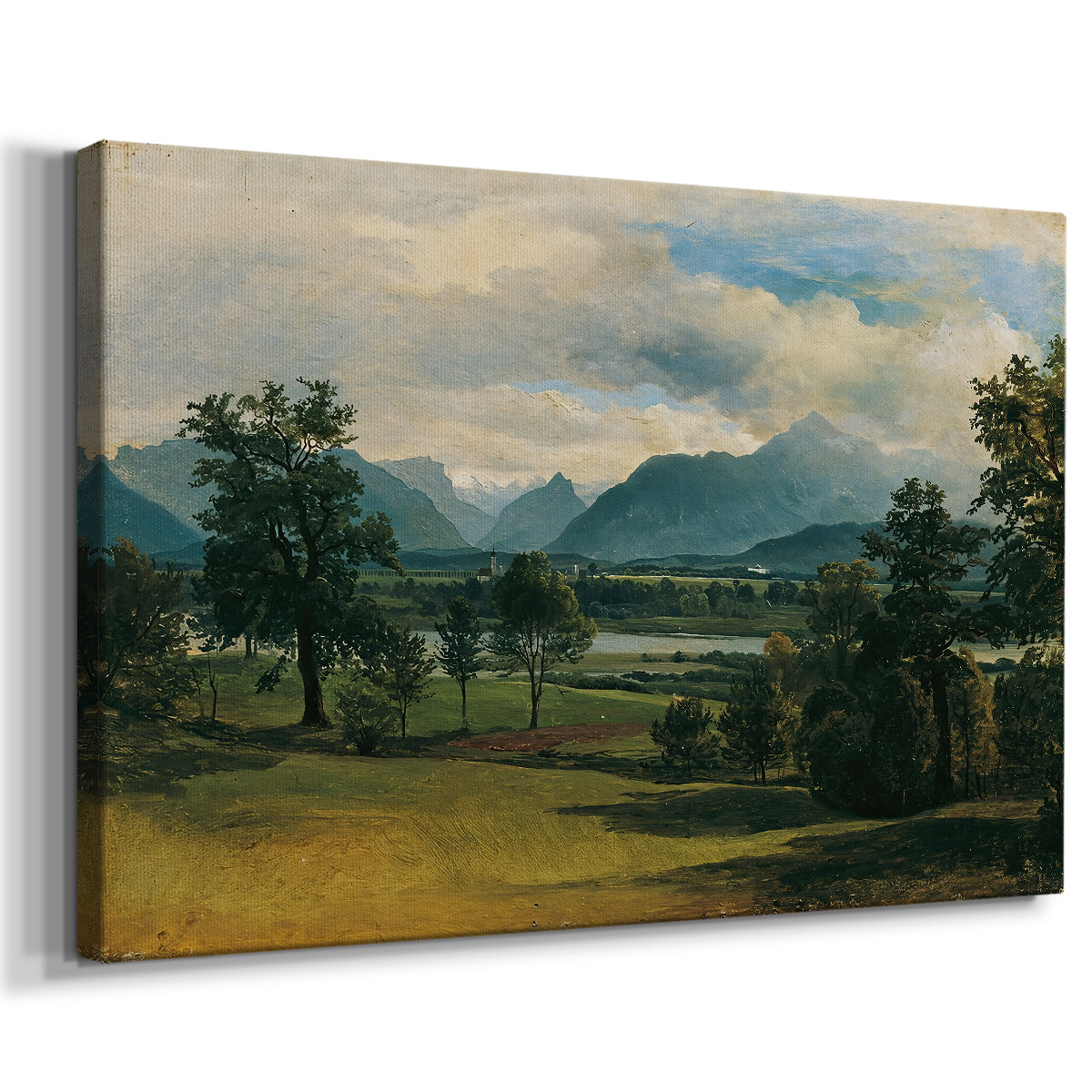 Canvas art print featuring a pastoral scene with distant buildings and natural terrain, displayed at an angle