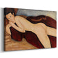 Canvas art print featuring a rear view of reclining female nude stretched across bed or sofa, displayed at an angle