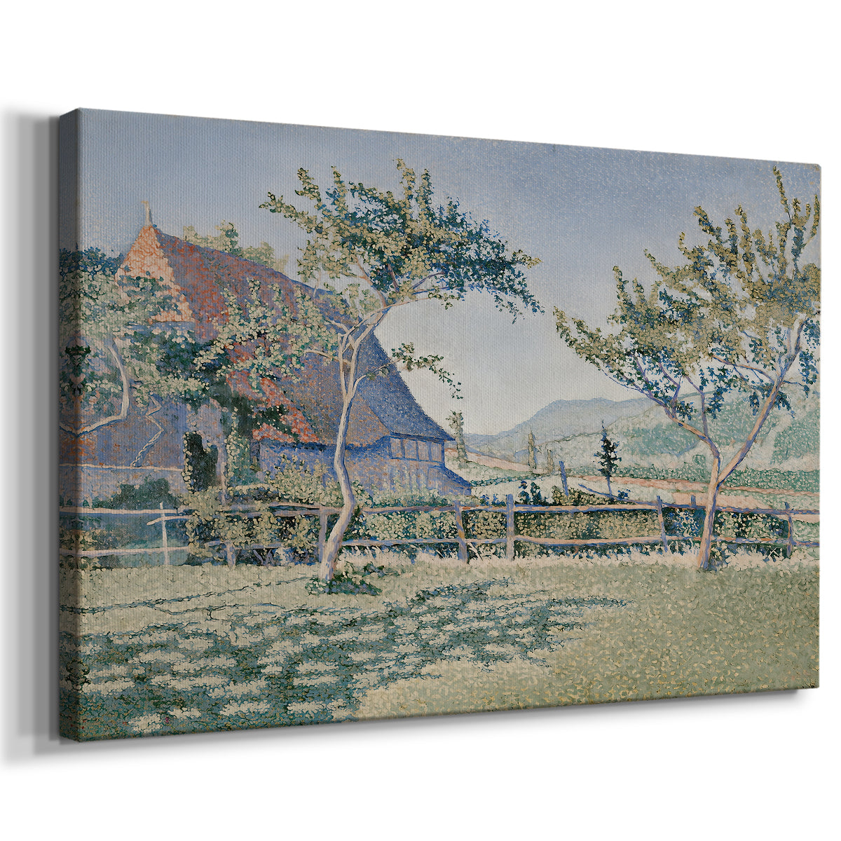 Canvas art print featuring a pointillist countryside scene with architecture and open field, displayed at an angle