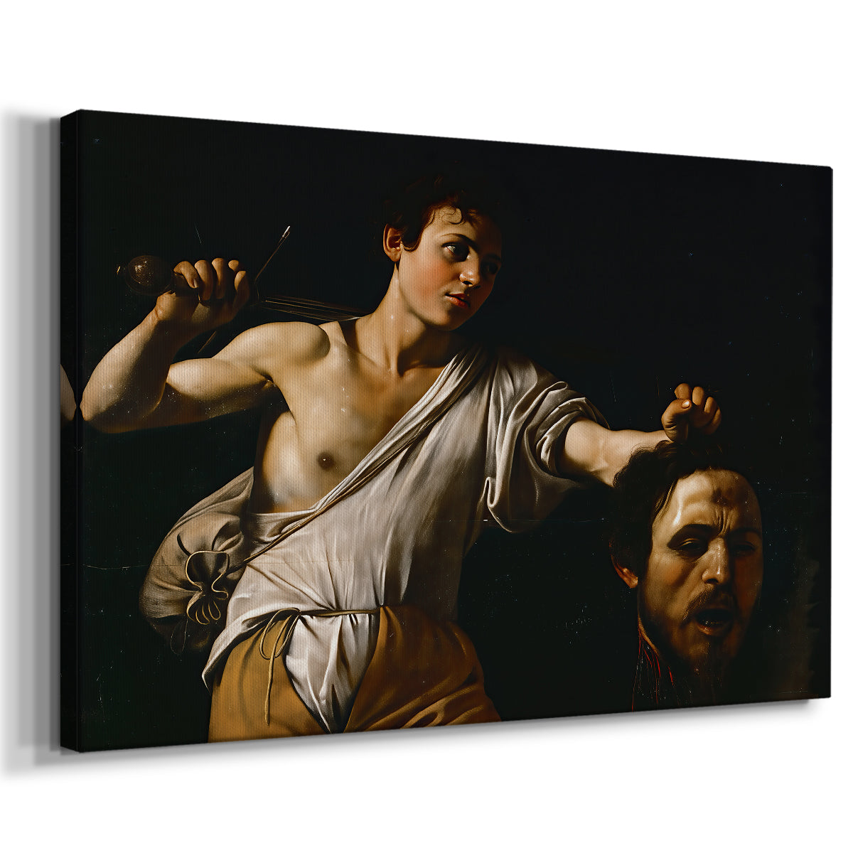 Canvas art print featuring a biblical scene of David gripping Goliath's head with dramatic lighting, displayed at an angle