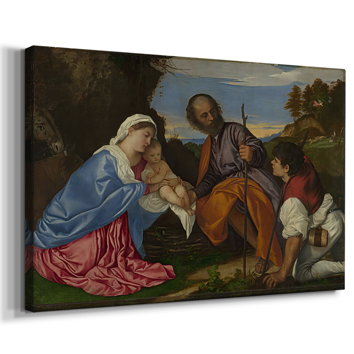 Canvas art print featuring a religious scene with seated figures and child in pastoral environment, displayed at an angle