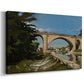 Canvas art print featuring an architectural landscape with bridge crossing calm river, displayed at an angle