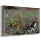 Canvas art print featuring a small cat resting among colorful flowers in grassy field, displayed at an angle