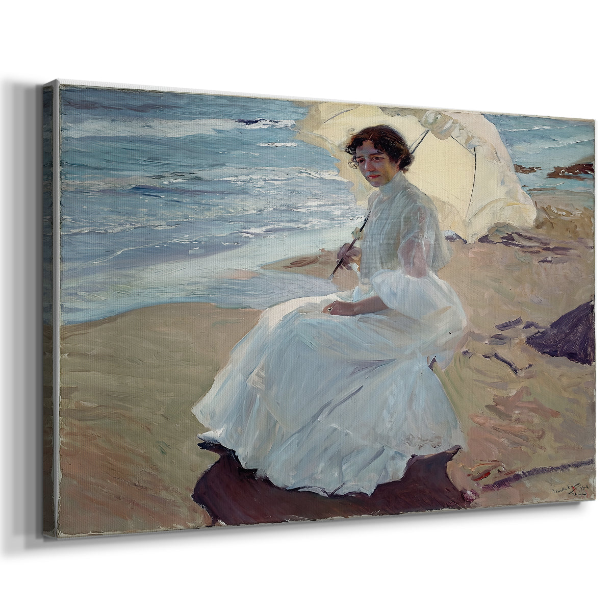 Canvas art print featuring a sunlit coastal portrait of woman near shoreline, displayed at an angle