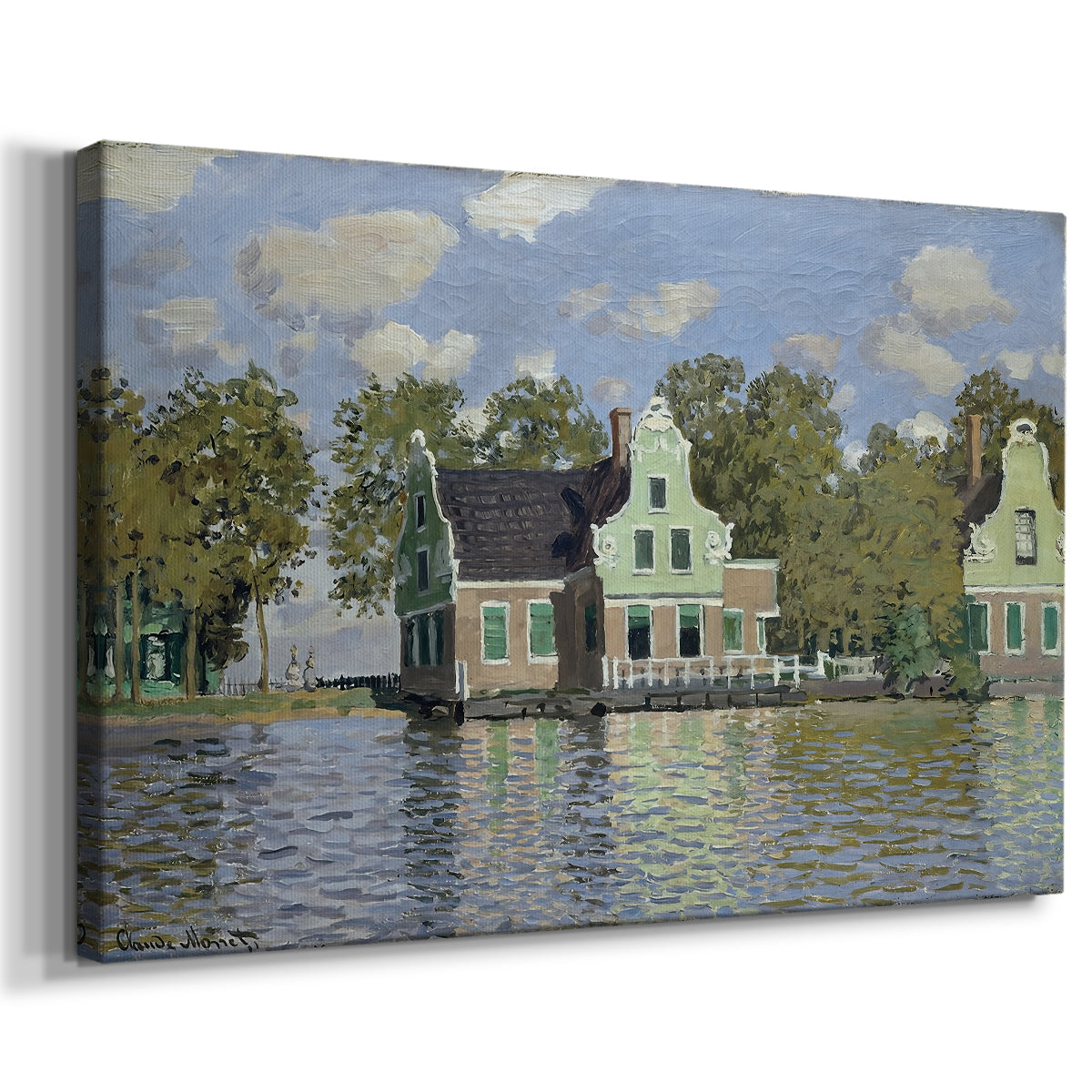 Canvas art print featuring an impressionist riverside village with colorful buildings, displayed at an angle