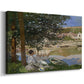 Canvas art print featuring a peaceful riverside scene with figures resting in grassy area by water, displayed at an angle