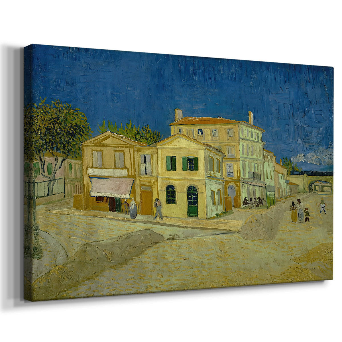 Canvas art print featuring an urban scene with bold-colored building along road, displayed at an angle
