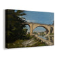 Canvas art print featuring an architectural landscape with bridge crossing calm river, displayed at an angle