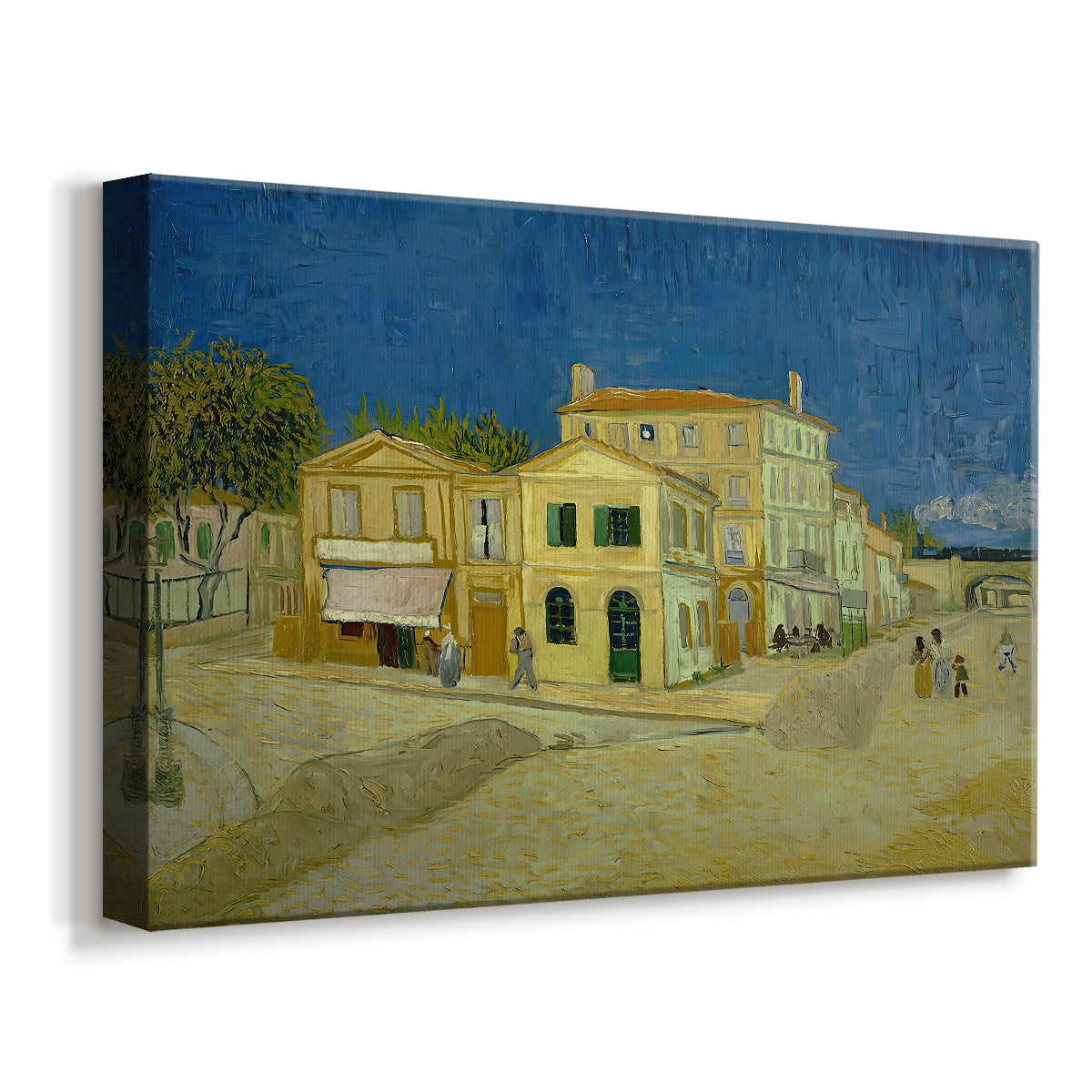 Canvas art print featuring an urban scene with bold-colored building along road, displayed at an angle
