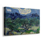 Canvas art print featuring a countryside scene with low trees and rocky hills beyond, displayed at an angle