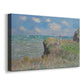 Canvas art print featuring an impressionist seaside landscape with people strolling above water, displayed at an angle