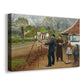 Canvas art print featuring a countryside scene with figures standing near workshop or smithy, displayed at an angle