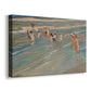 Canvas art print featuring a lively beach scene with kids running near water, displayed at an angle