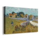 Canvas art print featuring a rural scene with building set within cultivated land, displayed at an angle