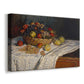 Canvas art print featuring an impressionist still life of fruit placed on cloth-covered surface, displayed at an angle