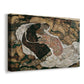 Canvas art print featuring a symbolic scene of mortality with two figures clinging together, displayed at an angle