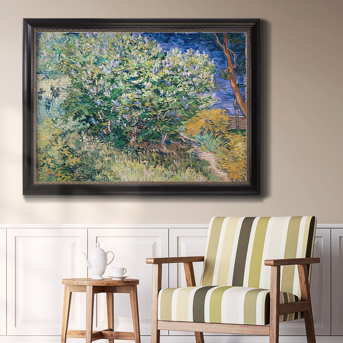 Impressionist lilac flower painting by Vincent van Gogh in an ornate black frame with gilded inner detail displayed in a light-toned interior setting.