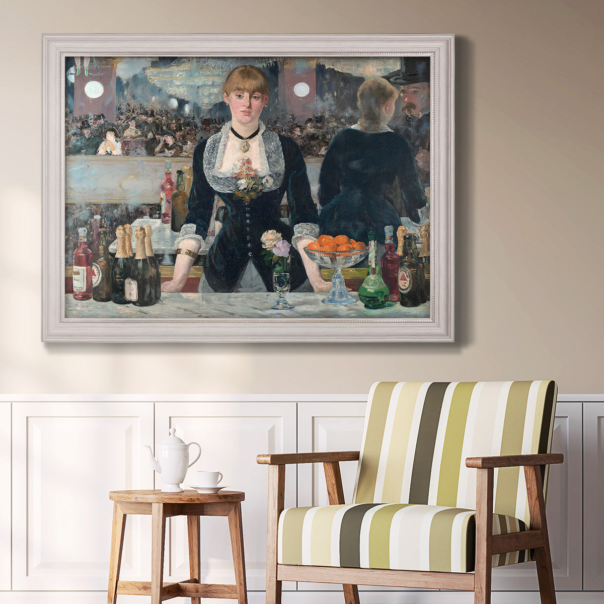 Iconic impressionist café bar scene by Édouard Manet in an ornate weathered white frame displayed in a light-toned interior setting.
