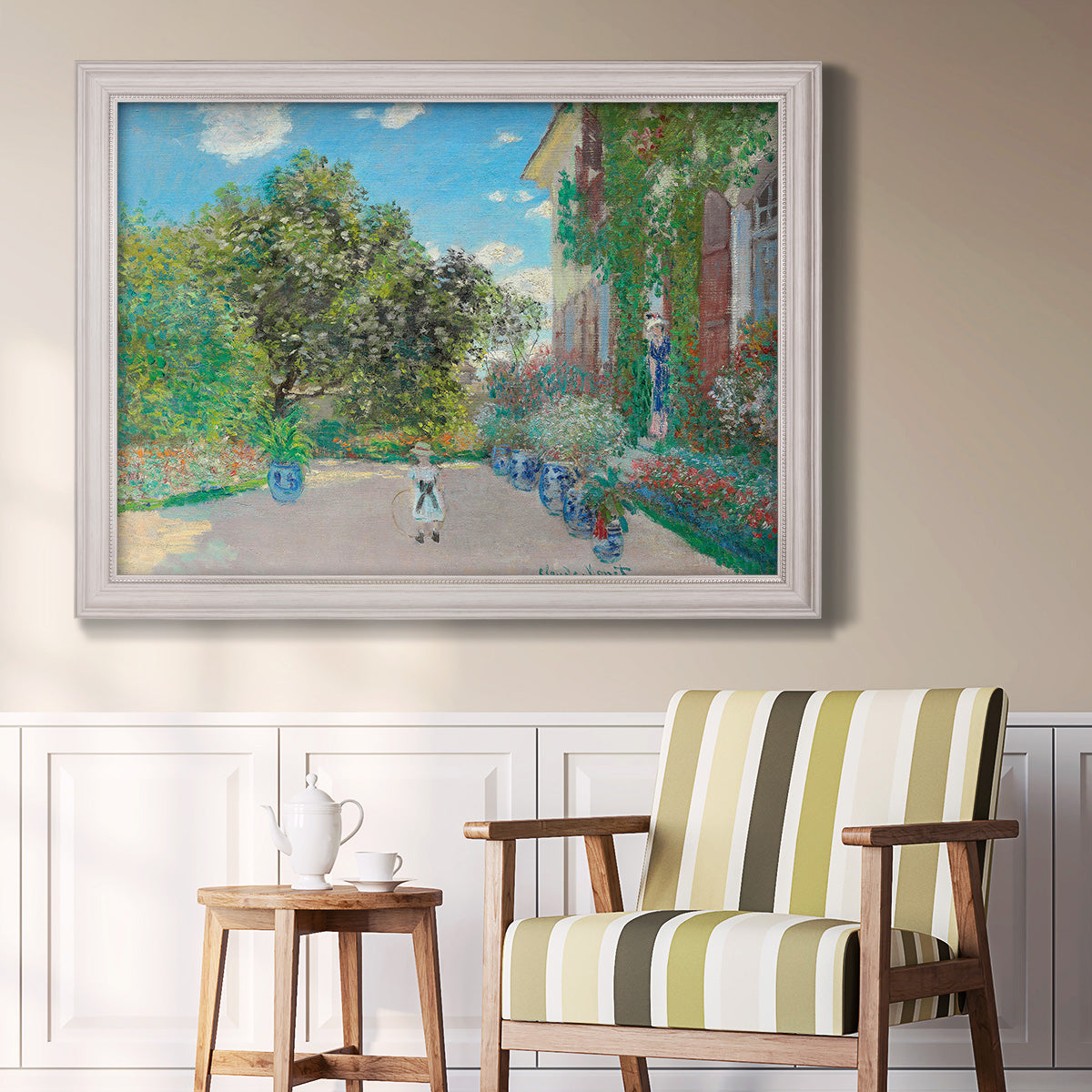Impressionist residential landscape at Argenteuil by Claude Monet in an ornate weathered white frame displayed in a light-toned interior setting.