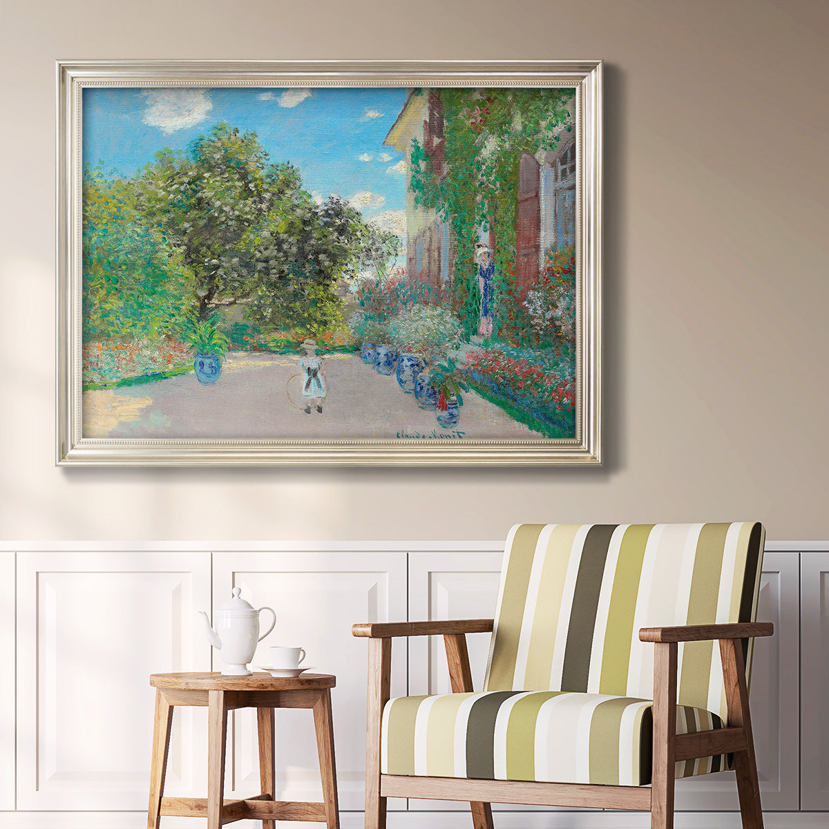 Impressionist residential landscape at Argenteuil by Claude Monet in an ornate champagne frame displayed in a light-toned interior setting.