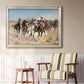 Impressionist western action scene by Frederic Remington in an ornate champagne frame displayed in a light-toned interior setting.