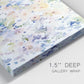 Close-up view of wrapped canvas corner featuring flowing abstract watercolor.