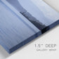 Close-up view of wrapped canvas corner featuring calm blue water landscape.