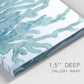 Close-up view of wrapped canvas corner featuring blue coral inspired watercolor.
