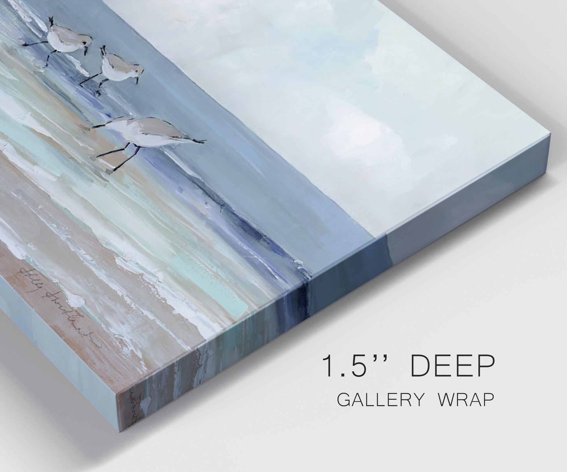 Close-up view of wrapped canvas corner featuring shore birds searching along beach.