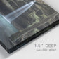 Close-up view of wrapped canvas corner featuring waterfall cascading through forest.