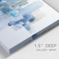 Close-up view of wrapped canvas corner featuring minimal urban skyline watercolor.