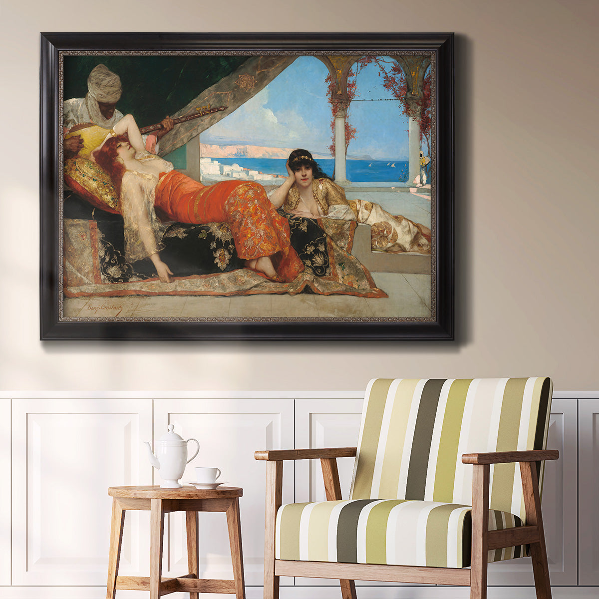 Orientalist portrait scene by Jean-Joseph Benjamin-Constant in an ornate black frame with gilded inner detail displayed in a light-toned interior setting.