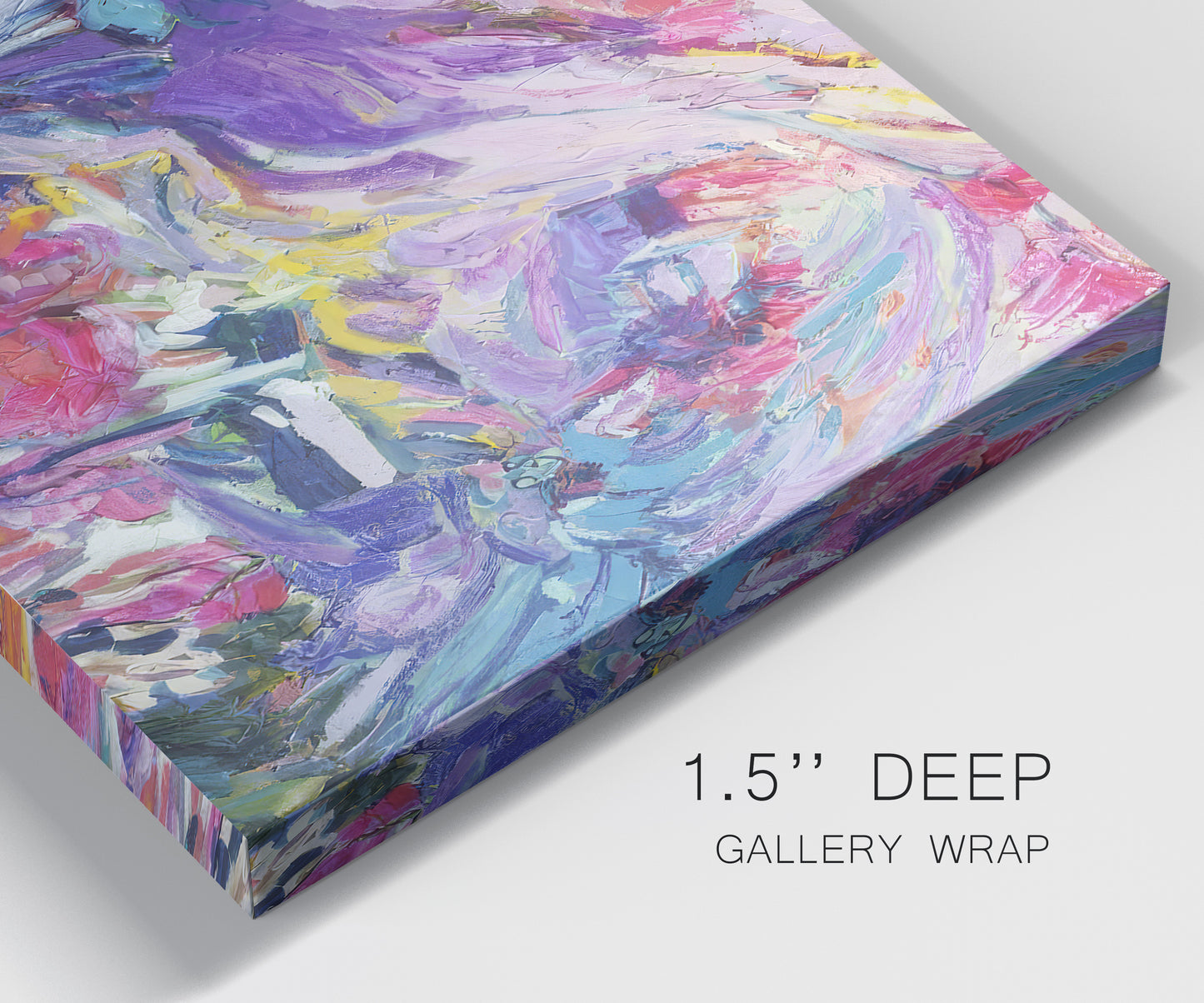 Close-up view of wrapped canvas corner featuring expressive abstract with layered color.
