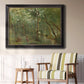 Traditional rural landscape scene with figures by Jean-Baptiste-Camille Corot in an ornate black frame with gilded inner detail displayed in a light-toned interior setting.