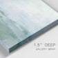 Close-up view of wrapped canvas corner featuring soft abstract coastal tones.