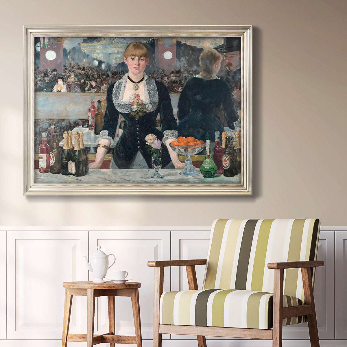 Iconic impressionist café bar scene by Édouard Manet in an ornate champagne frame displayed in a light-toned interior setting.