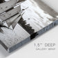 Close-up view of wrapped canvas corner featuring historic sailing ships photograph.