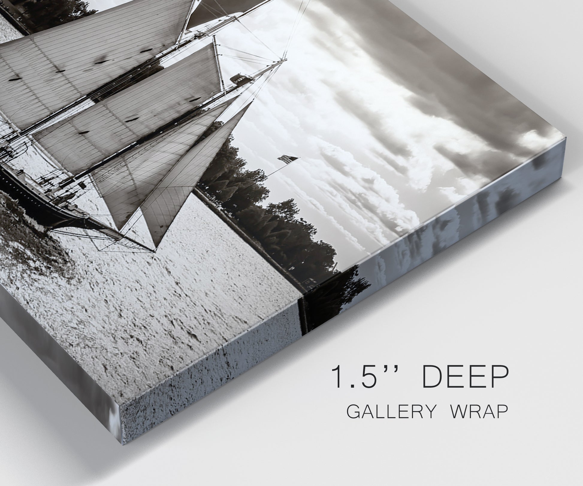 Close-up view of wrapped canvas corner featuring historic sailing ships photograph.
