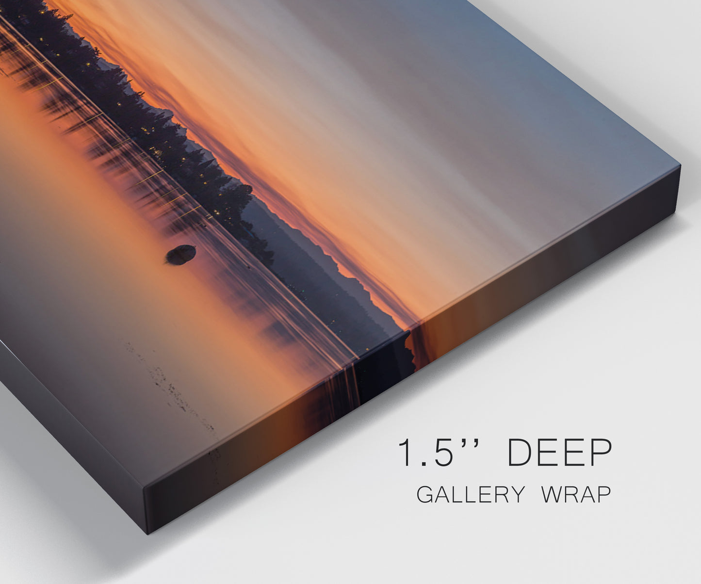 Close-up view of wrapped canvas corner featuring glowing sunset over water.