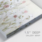 Close-up view of wrapped canvas corner featuring loose farmhouse style floral painting.