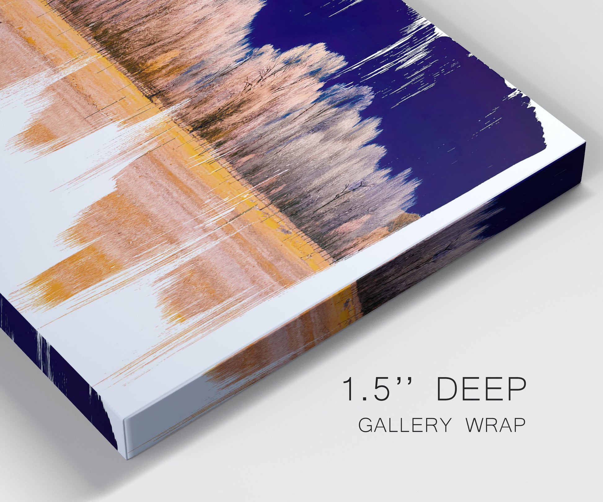 Close-up view of wrapped canvas corner featuring panoramic treeline landscape photograph.