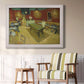 Impressionist interior of a night café by Vincent van Gogh in an ornate weathered white frame displayed in a light-toned interior setting.