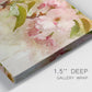 Close-up view of wrapped canvas corner featuring soft floral blossom composition.