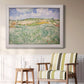 Impressionist countryside landscape near Auvers by Vincent van Gogh in an ornate weathered white frame displayed in a light-toned interior setting.