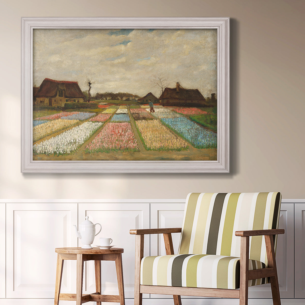 Impressionist Dutch bulb field landscape by Vincent van Gogh in an ornate weathered white frame displayed in a light-toned interior setting.