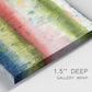 Close-up view of wrapped canvas corner featuring layered abstract color banding.